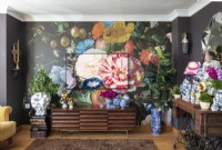 Colourful floral wallpaper in eclectic living room