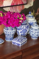 Display of blue and white ceramics and flowers