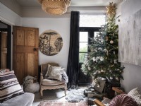 Small living room with Christmas tree and gifts