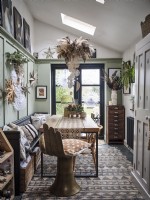 Rustic Scandinavian dining room with table and Christmas decorations