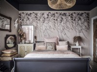 Pink Bohemian bedroom with mural wallpaper