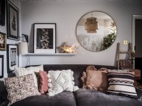 Small living room with velvet sofa, shelf and Pictures