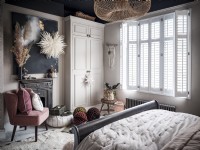 Bohemian bedroom with fitted wardrobe and shutters