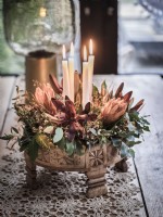 Flower floiage and candle centrepiece arrangemnt