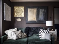 Living room detail, velvet sofa with wall hung artwork