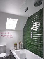 Small green and white bathroom with metro tiles