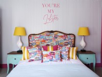 Colourful coastal bed with upholstered headboard