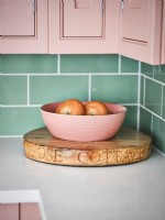 Detail of pink bowl on chopping board