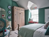 Colourful coastal bedroom in green and white