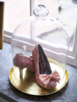 Bow beaded shoes in glass cloche