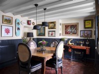 Quirky coastal themed dining room with upholstered chairs