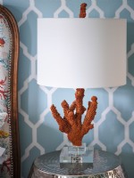 Brown and white coral sculptured lamp on bedside table