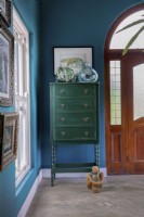 Entrance hall with green chest of drawers
