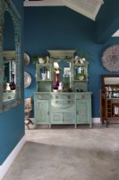 Painted vintage dresser with collection of ornaments