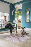Homeowner with pet dog - feature portrait