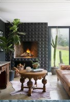 Living area with ceramic tile clad fireplace