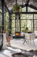 Dining area with fireplace in greenhouse