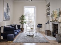 Classic living room with feature window and house plants