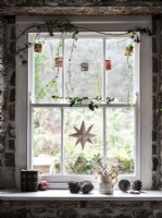 Christmas decorations and lanterns on window