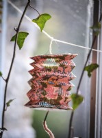 Lantern decoration hanging from window
