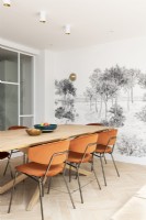 Contemporary dining room with wall mural