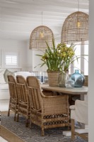 Dining area with rattan pendant lights