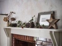 Mantel with rustic Christmas decorations