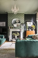 Green modern living room with feature wall chimney breast