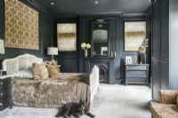 Pet dog in modern bedroom with black painted walls