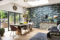 Modern dining room with blue and green feature wall