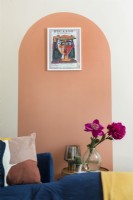 Orange arch painted on wall of living room