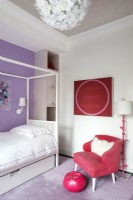 Girls bedroom decorated in purple, red and white