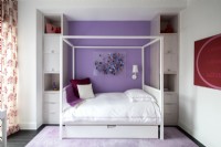 Girls bedroom decorated in purple, red and white