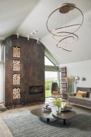 Corten steel fireplace wall in contemporary living room