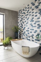 Patterned tiled wall in modern bathroom