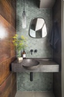 Concrete sink in contemporary bathroom