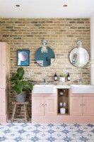 Modern bathroom with exposed brick wall