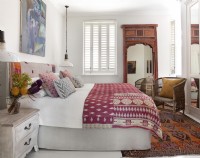Bedroom featuring eclectic decor