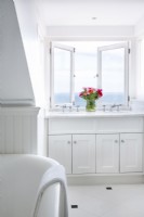 Classic bathroom with view of ocean from window