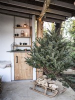 Christmas tree in rustic outdoor living space