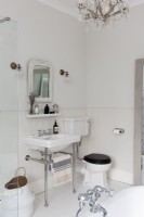 Classic bathroom with traditional sink and painted mirror