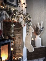 Christmas decorations above wood burning stove