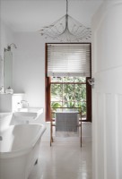 White bathroom with large sash window