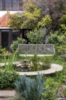 Garden with bench and pond