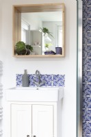 Sink detail in contemporary blue and white family Bathroom
