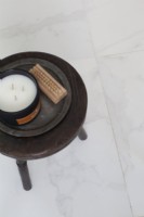 Detail of stool with candle, Mable tiles. 
