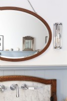 Detail wash stand and basin, classic taps, oval mirror. 
