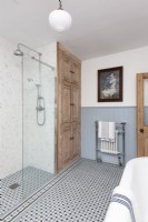 Stripped Pine doors in blue and white bathroom. 