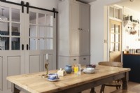 Open plan dining room in shaker style kitchen