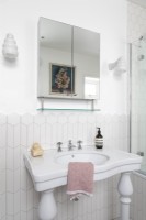 Traditional sink in feminine bathroom